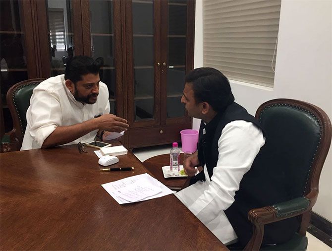 Akhilesh Yadav, right, confers with a Samajwadi Party leader at his Lucknow office, March 26, 2017. Photograph: Archana Masih/Rediff.com