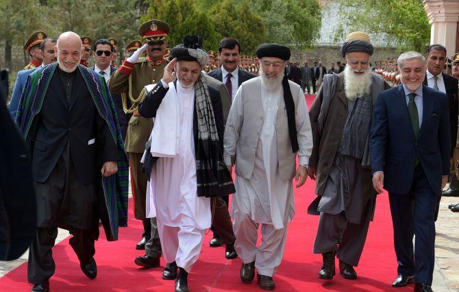 From left to right: Former Afghan President Hamid Karzai, Afghan President Ashraf Ghani, warlord Gulbuddin Hekmatyar, former jihadi leader Abdul Rabb Rasool Sayyaf and Afghanistan Chief Executive Abdullah Abdullah attend a ceremony at the presidential palace in Kabul, May 4, 2017. Photograph: Shah Marai/Reuters