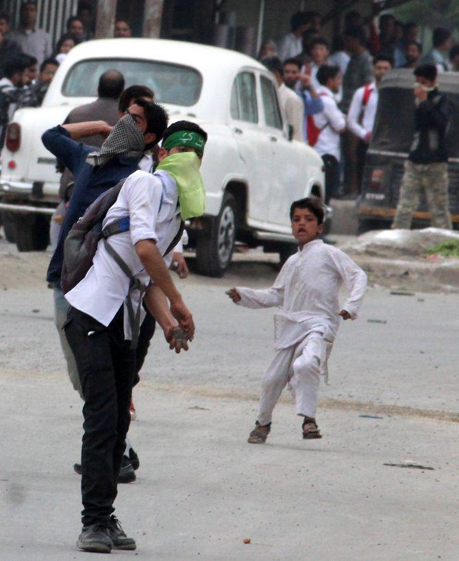 Children pelt stones at the security forces in Srinagar May 2017. Photograph: Umar Ganie