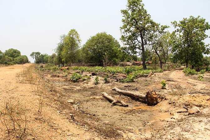 Just a kilometre up the road is CRPF's Burkapal camp and seen on the right is Burkapal village. The CRPF strongly suspects that the villagers helped the Maoists during teh ambush. The ambush spot is to the left of this photograph