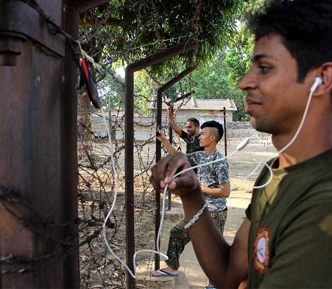 When Rediff.com's Prasanna D Zore and Uttam Ghosh visited Gangaloor camp in Bijapur district on May 6, they discovered jawans of the CoBRA (Combat Battalion for Resistive Action, a specially trained force of the CRPF) battalion hooked onto their mobile phones along the gates of the Gangaloor police station. The jawans said it was the only location around the entire CRPF camp that had some network connectivity.