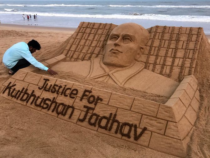 Sand artist Sudarsan Patnaik creates a sand sculpture for Kulbhushan Jadhav at the Puri beach in Odisha. Photograph: PTI Photo