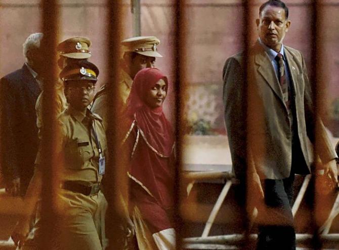 Akhila Ashokan aka Hadiya accompanied by police officers and court officials. Photograph: PTI