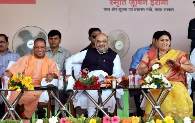 Yogi Adityanath with BJP President Amit A Shah and I&B Minister Smriti Zubin Irani