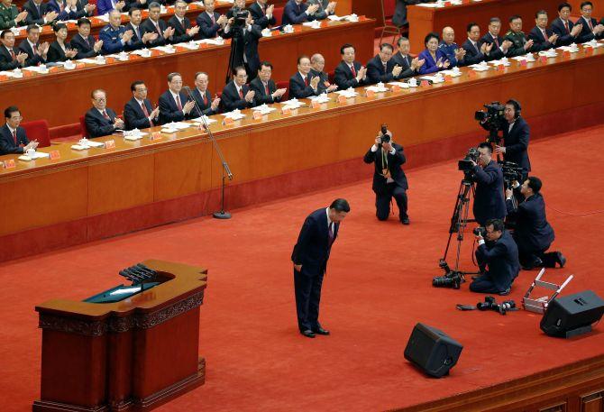 Chinese President Xi Jinping acknowledges the applause at the Chinese Communist Party's 19th party congress in Beijing, October 18, 2017. Photograph: Thomas Peter/Reuters