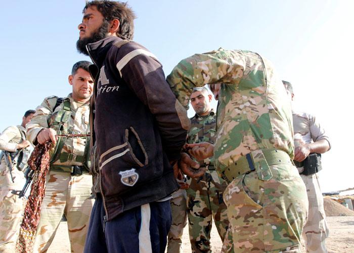 Kurdish Peshmerga forces detain an Islamic State terrorist southwest of Kirkuk, Iraq, October 5, 2017. Photograph: Ako Rasheed/Reuters