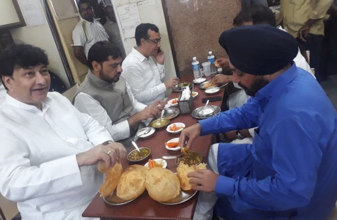 A photograph of Congress leaders in Delhi eating before sitting on a fast was circulated on social media, April 9, 2018. Photograph: ANI