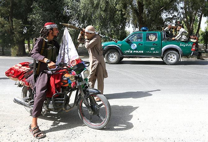 Afghan security forces and Taliban terrorists cross each other warily during a ceasefire in Bati Kot district, Nangarhar province, Afghanistan, June 16, 2018. Photograph: Parwiz/Reuters