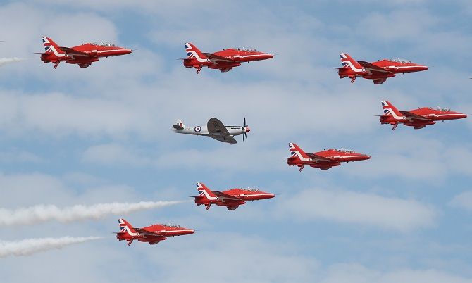 The Red Arrows, the Royal Air Force Aerobatic Team, are joined by a Spitfire at the opening of the Farnborough Airshow, in Farnborough, July 16, 2018. Photograph: Peter Nicholls/Reuters