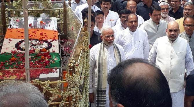 Prime Minister Narendra Damodardas Modi and Bharatiya Janata Party President Amit Anilchandra Shah walk alongside the late former prime minister Atal Bihari Vajpayee's funeral procession in New Delhi, August 17, 2018. Photograph: ANI.