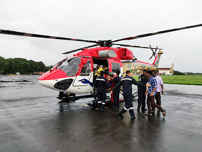 Rescued citizens getting off at the helipad