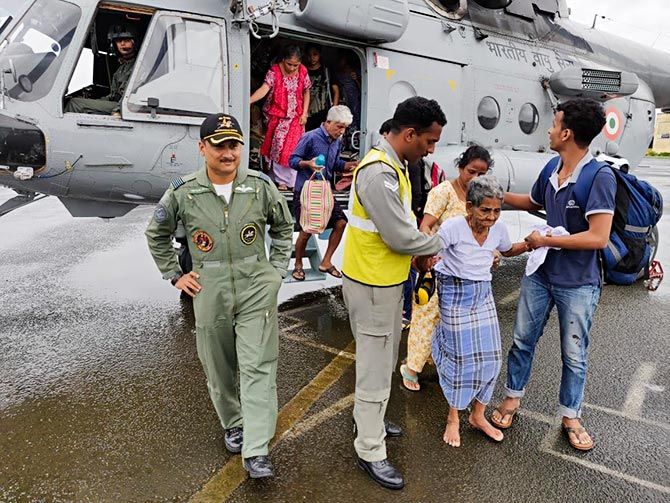 Wing Commander Shivang Kumar at the base of his chopper.