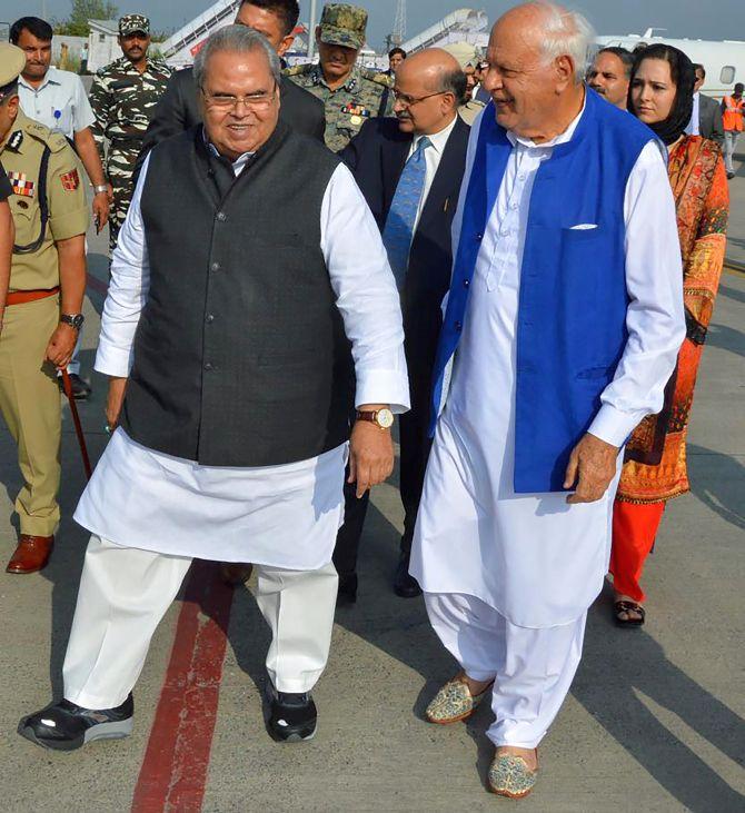 Jammu and Kashmir Governor Satya Pal Malik with former J&K chief minister Dr Farooq Abdullah at Srinagar airport, August 23, 2018.