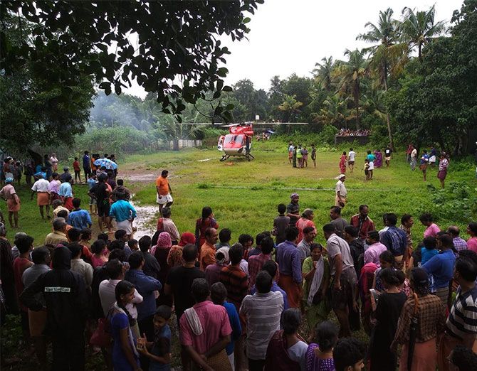 An IAF helicopter lands at the make-shift helipad made by Basil George and locals