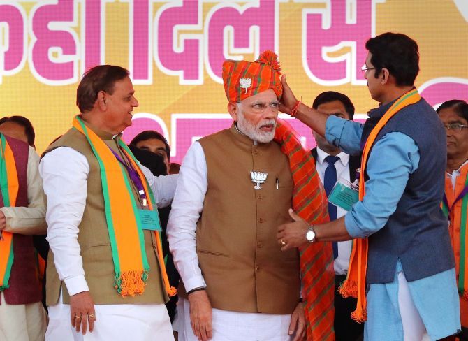 Prime Minister Narendra Damodardas Modi being welcomed by Union Sports Minister Rajyawardhan Singh Rathore at an election rally in Jaipur. Photograph: PTI Photo