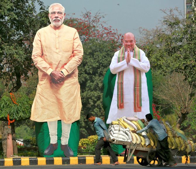 Prime Minister Narendra Damodardas Modi and Amit Anilchandra billboards in the Indian countryside