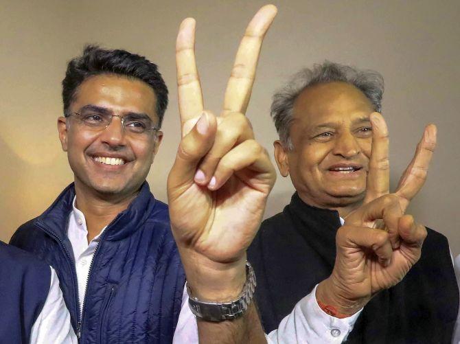 Congress leaders Sachin Pilot and Ashok Gehlot flash victory signs after the declaration of the Rajasthan assembly election results. Photograph: PTI Photo