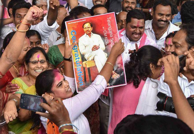 IMAGE: TRS workers celebrate their party's victory in the assembly election at Telangana Bhavan in Hyderabad, December 11, 2017. Photograph: PTI Photo