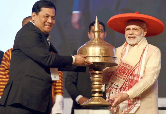 Prime Minister Narendra Damodardas Modi is felicitated by Assam Chief Minister Sarbananda Sonowal at the inauguration of the Advantage Assam programme at the Indira Gandhi Athletic Stadium, Guwahati, February 3, 2018. Photograph: PTI Photo