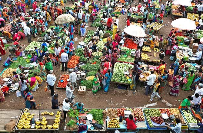 Customers shop at an open air evening vegetable and fruit market in Ahmedabad, India July 28, 2016. Photograph: Amit Dave/Reuters