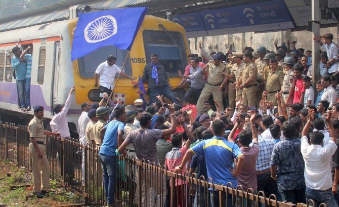 Dalit protesters block a train at Dadar, central Mumbai, January 3, 2018 during a Maharashtra bandh. Photograph: PTI Photo 