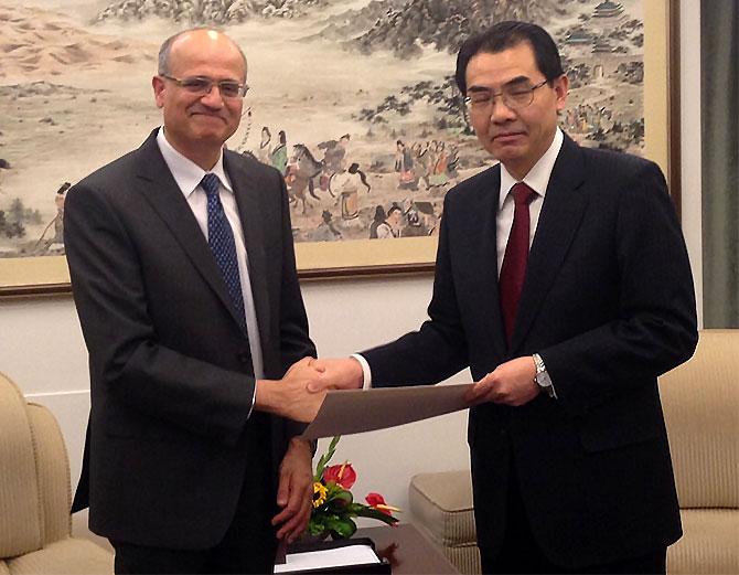 Vijay Gokhale presents a copy of his credentials as India's ambassador to China to China's director general of protocol. Photograph: Kind courtesy: MEA