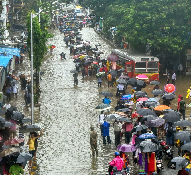 Downpour continues in Mumbai; roads flooded, trains delayed - Rediff ...