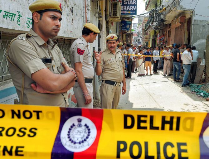 Police personnel near the house where 11 members of a family were found hanging, Burari, New Delhi, July 1, 2018. Photograph: Shahbaz Khan/PTI Photo