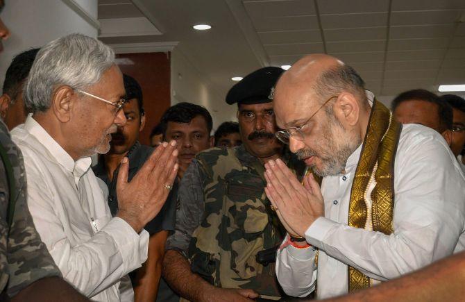 Bharatiya Janata Party President Amit Anilchandra Shah greets Bihar Chief Minister Nitish Kumar at the state guest house in Patna, July 12, 2018. Photograph: PTI Photo