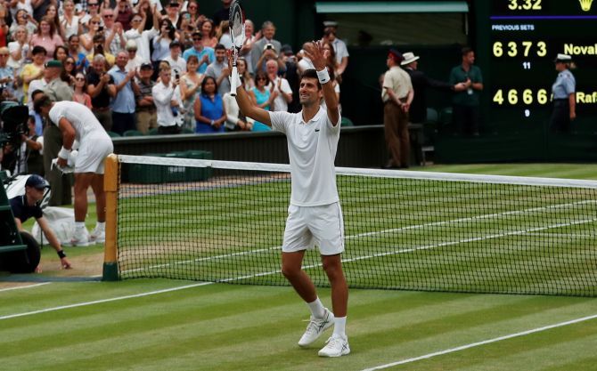 Serbia's Novak Djokovic celebrates winning his semi final match against Spain's Rafael Nadal