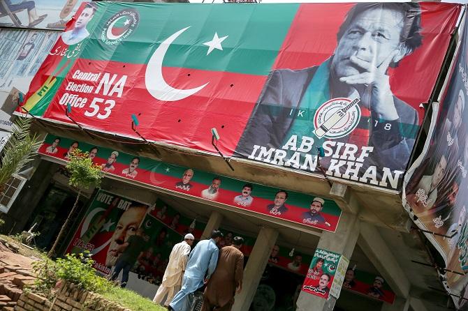 The poster in an Islamabad market, July 27, 2018, says it all. Photograph: Athit Perawongmetha/Reuters