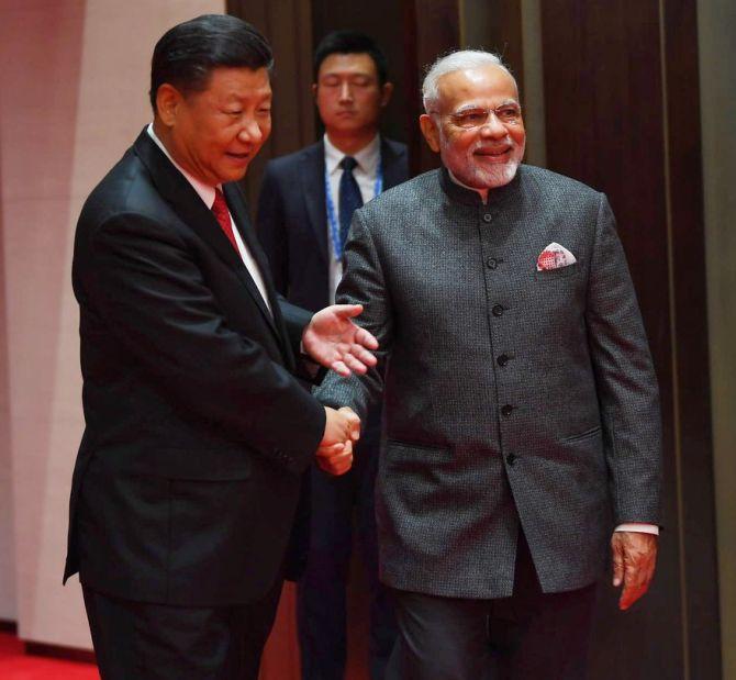 Prime Minister Narendra D Modi and China's Supreme Leader Xi Jinping at their meeting in Qingdao, China, June 9, 2018. Photograph: Press Information Bureau