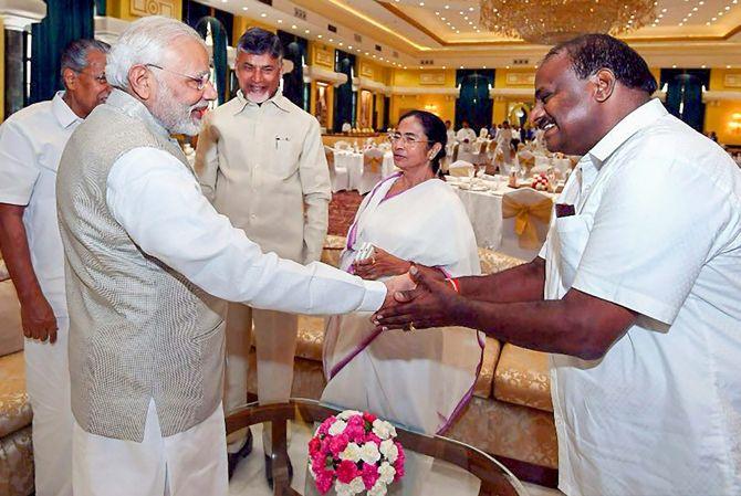 Prime Minister Narendra Damodardas Modi greets Karnataka Chief Minister H D Kumaraswamy as West Bengal CM Mamata Banerjee, Kerala CM Pinarayi Vijayan and Andhra Pradesh CM Nara Chandrababu Naidu look on at the NITI Aayog governing council meeting in New Delhi, June 17, 2018. Photograph: PTI Photo