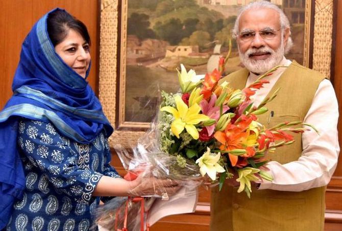 Mehbooba Mufti, then Kashmir's chief minister, heading a PDP-BJP alliance government, with Prime Minister Narendra Damodardas Modi. Photograph: PTI Photo