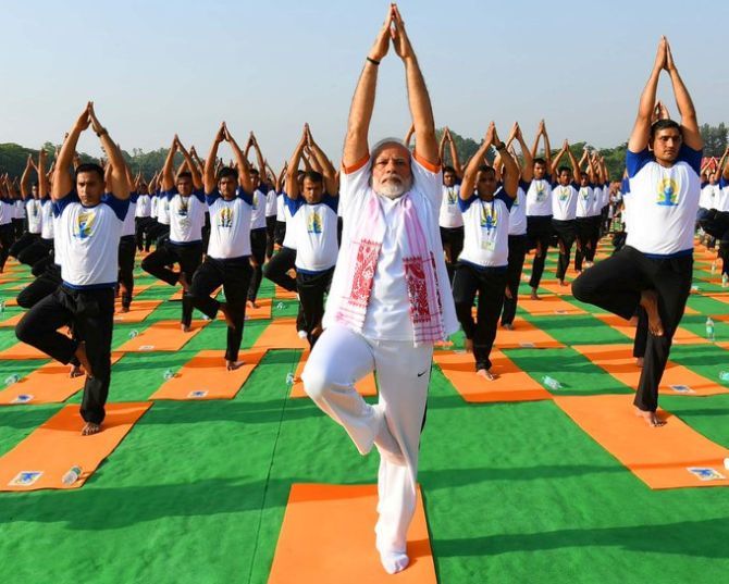 Modi practises yoga in Dehradun on World Yoga Day 2018