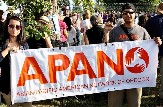 Chi Nguyen, interim Executive Director, Asian Pacific American Network of Oregon, left, and Jai Singh, field organiser, APANO, at the vigil outside the prison in Sheridan, Oregon, June 18, 2018.