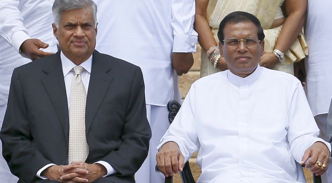 Sri Lankan President Maithripala Sirisena, right, with ousted prime minister Ranil Wickremesinghe. Photograph: Dinuka Liyanawatte/Reuters