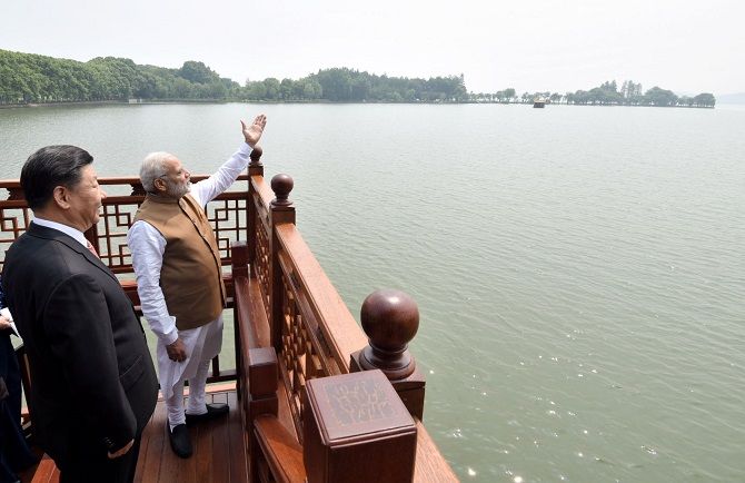 Prime Minister Narendra D Modi and China's Supreme Leader Xi Jinping on a house boat, in Wuhan's East Lake, China, April 28, 2018. Photograph: Press Information Bureau
