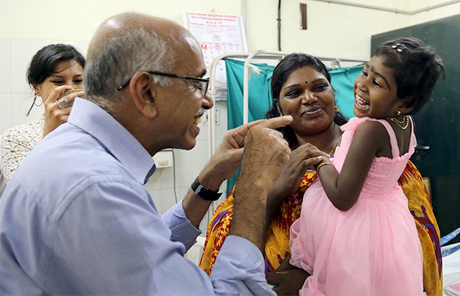 Dr M R Rajagopal of Palliam India with a young patient. Photograph: Kind courtesy Palliam India