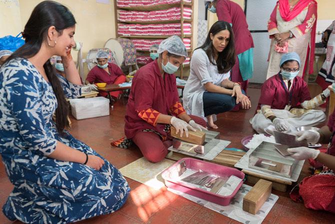 Suhani Jalota, left, with Meghan Markle and the staff at the Myna Mahila Foundation