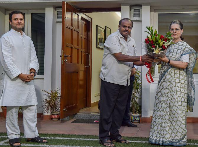 Janata Dal-Secular leader H D Kumaraswamy with Congress leaders Sonia and Rahul Gandhi in New Delhi, May 21, 2018. Photograph: Manvender Vashist/PTI Photo