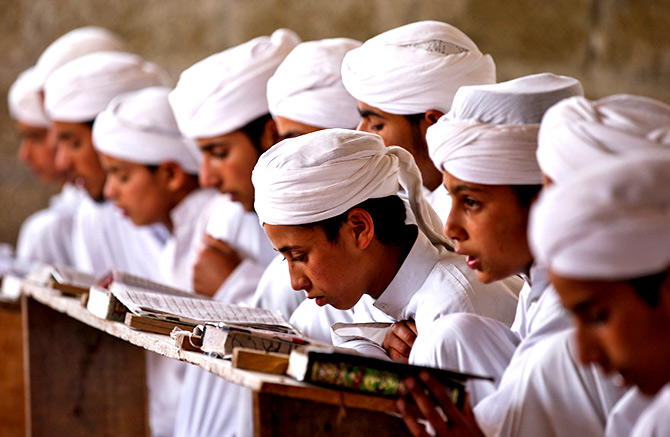 Young boys study at a madrasa
