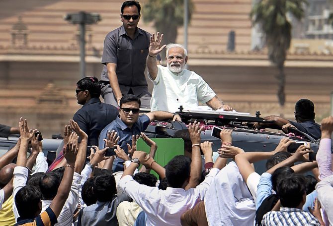 Prime Minister Narendra D Modi waves to crowds while inaugurating the first phase of the Delhi-Meerut Expressway. Photograph: Ravi Choudhary/PTI Photo