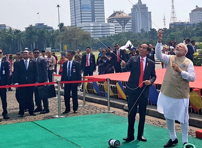 Prime Minister Narendra D Modi and and Indonesian President Joko Widodo fly kites as they inaugurated the first joint kite exhibition themed on India's largest epics the Ramayana and Mahabharata at Jakarta's National Monument. Photograph: @MEAIndia/Twitter