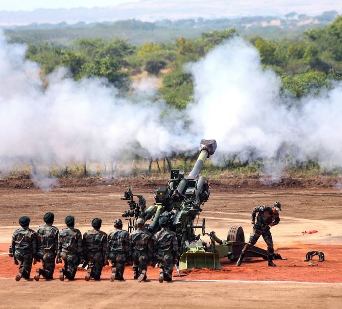 IMAGE: M777 Howitzer gun fires in the air. Photograph: PTI Photo