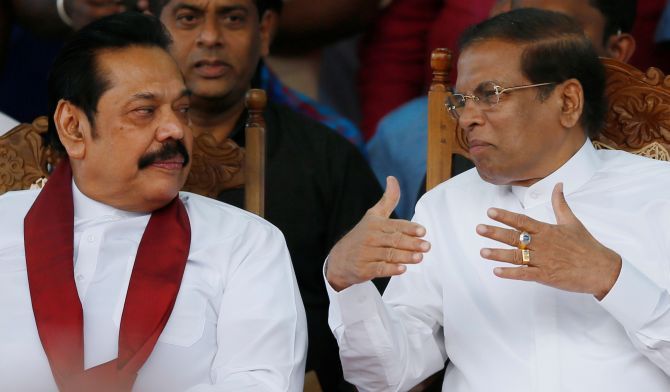 Caretaker Prime Minister Mahinda Rajapaksa and President Maithripala Sirisena at a rally in Colombo. Photograph: Dinuka Liyanawatte/Reuters