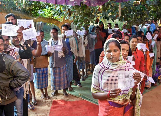 Voters wait in queues to cast their votes during the first phase of assembly elections in Chhattisgarh at a polling station in Narayanpur, November 12, 2018. Photograph: PTI Photo