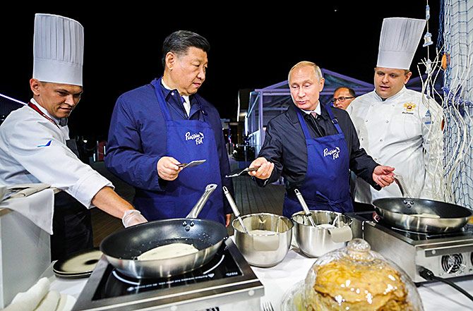 Xi and Russian President Vladimir Putin make pancakes during a visit to the Far East Street exhibition on the sidelines of the Eastern Economic Forum in Vladivostok, Russia, September 11, 2018. Photograph: Sergei Bobylev/TASS/Pool via Reuters