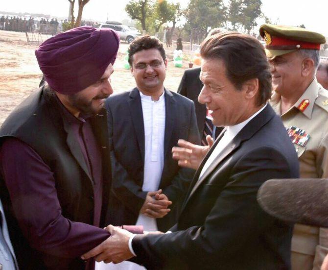 Pakistan Prime Minister Imran Khan with his old cricket rival Navjot Singh Sidhu at the groundbreaking ceremony for the proposed Kartarpur corridor. Photograph: PTI Photo