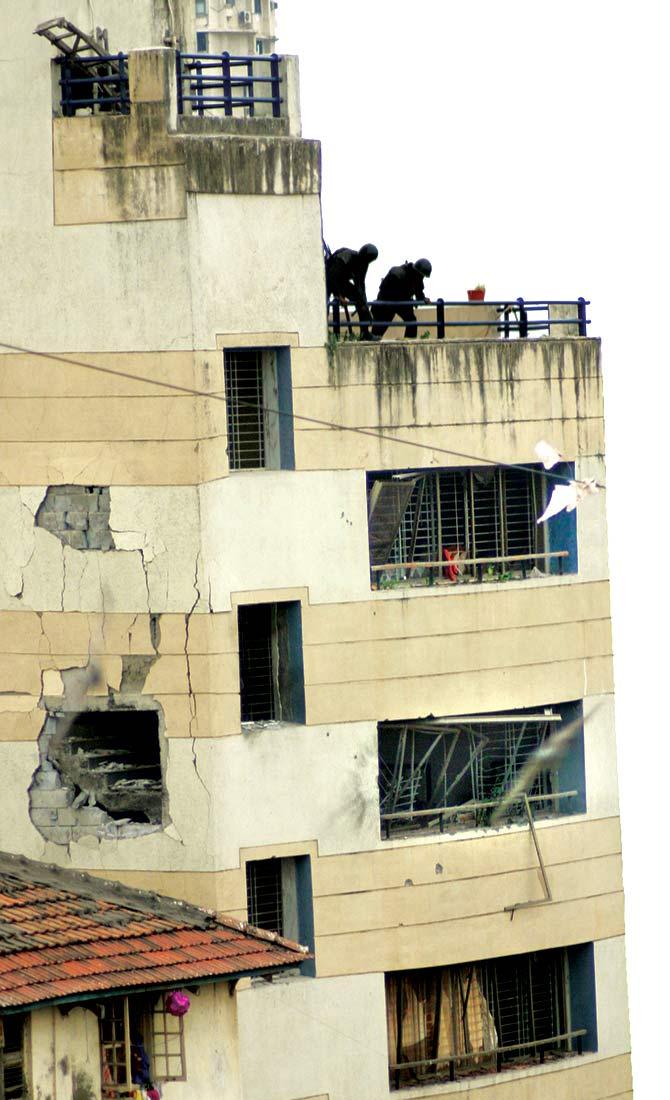 NSG commandos take positions during the operation to evict Nariman House of Pakistani terrorists, November 28, 2008.. Photograph: Rajesh Karkera/Rediff.com